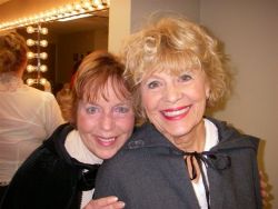 Deni looking over the shoulder of Annie Spracklen during the musical "Oliver"